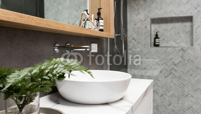 Bathroom-details-clean-white-basin-with-shower-tiling-behind.jpg