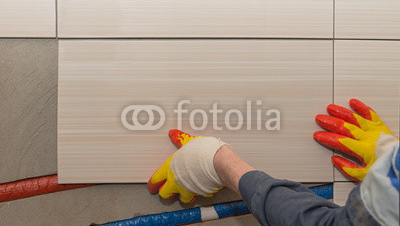 laying-tiles-on-the-wall.jpg